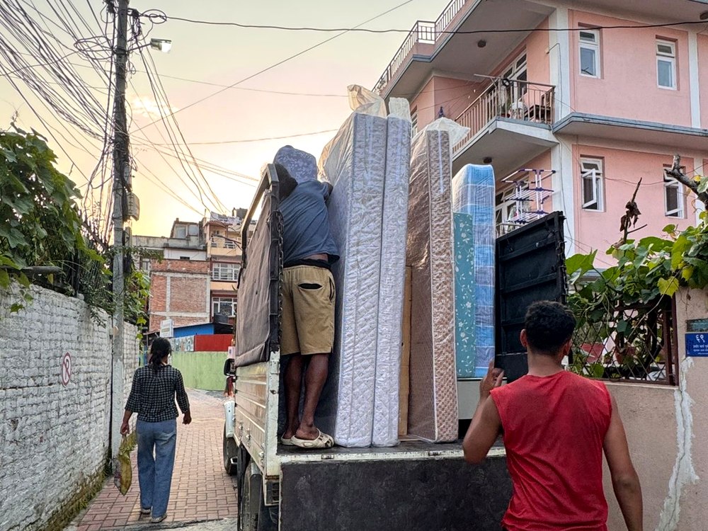 Team loading household furniture onto truck